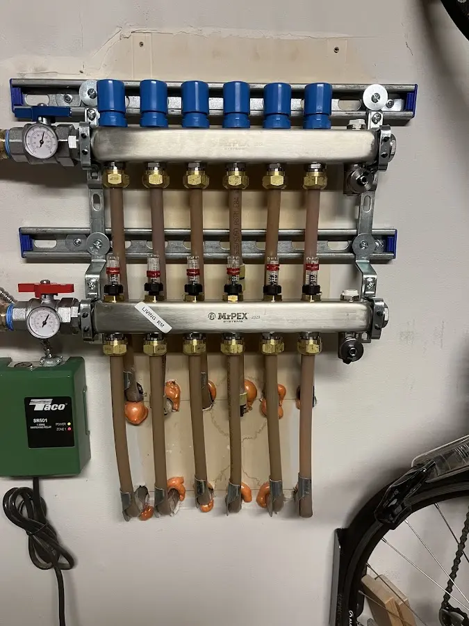 Plumber performing Water Heater Repair at a residential property in East Moline